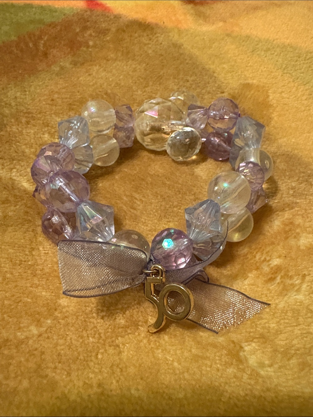 Disney Lavender and Iridescent Bead Bracelet with Gold 50th WDW Anniv Charm